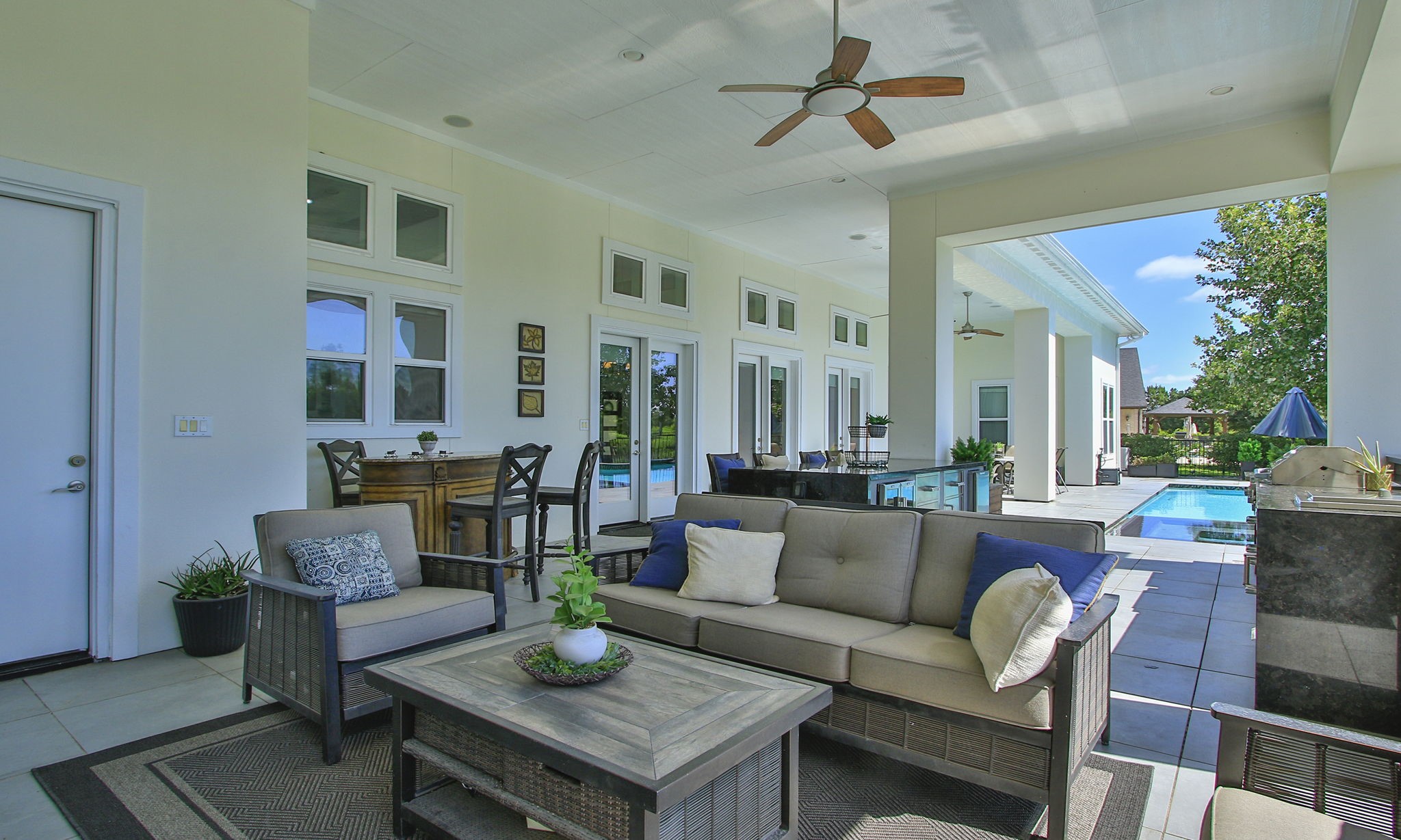 28518 Hoffman Spring Lane Fulshear, TX 77441 - Photo 1 of 50 This is a lifestyle! Your backyard oasis featuring heated pool and spa, summer kitchen and several sitting areas.