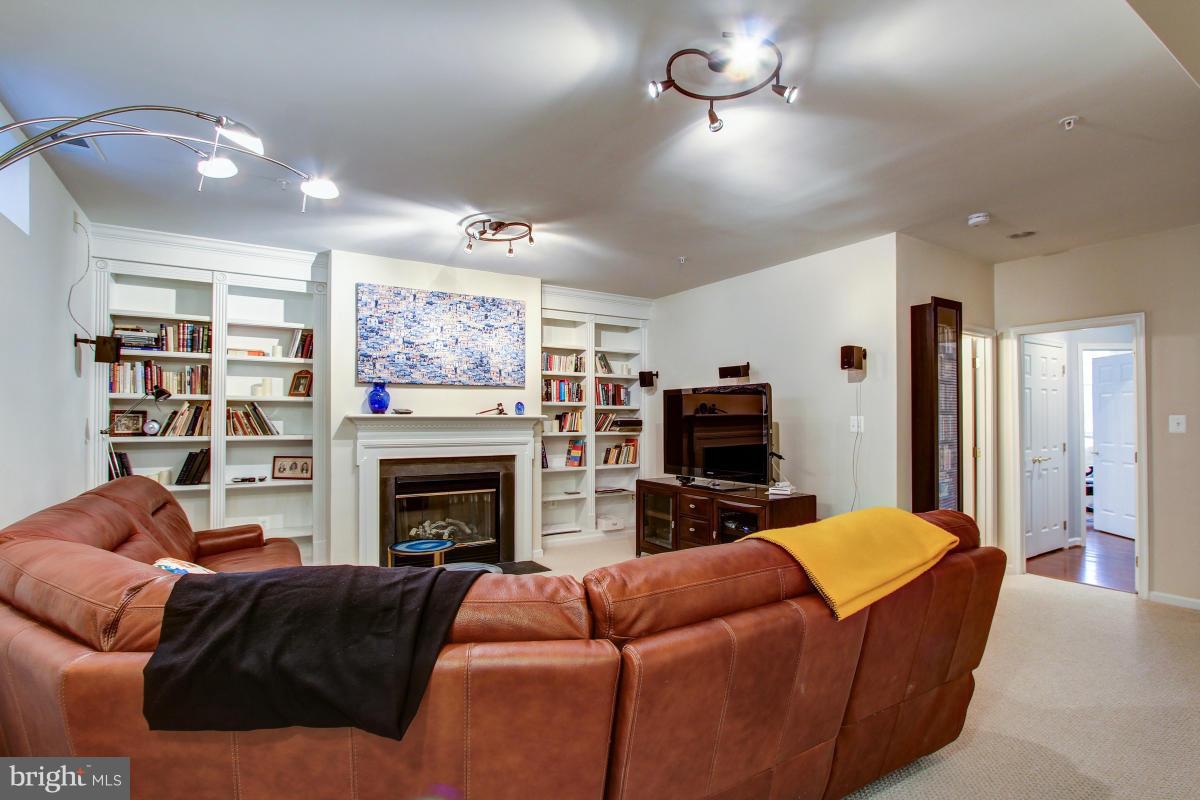 725 Ridgemont Avenue Rockville, MD 20850 - Photo 21 of 29 Recreational room with Fireplace