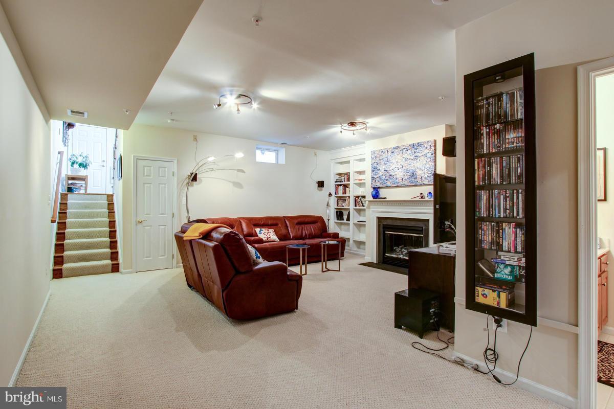 725 Ridgemont Avenue Rockville, MD 20850 - Photo 22 of 29 Recreational Room with Fireplace