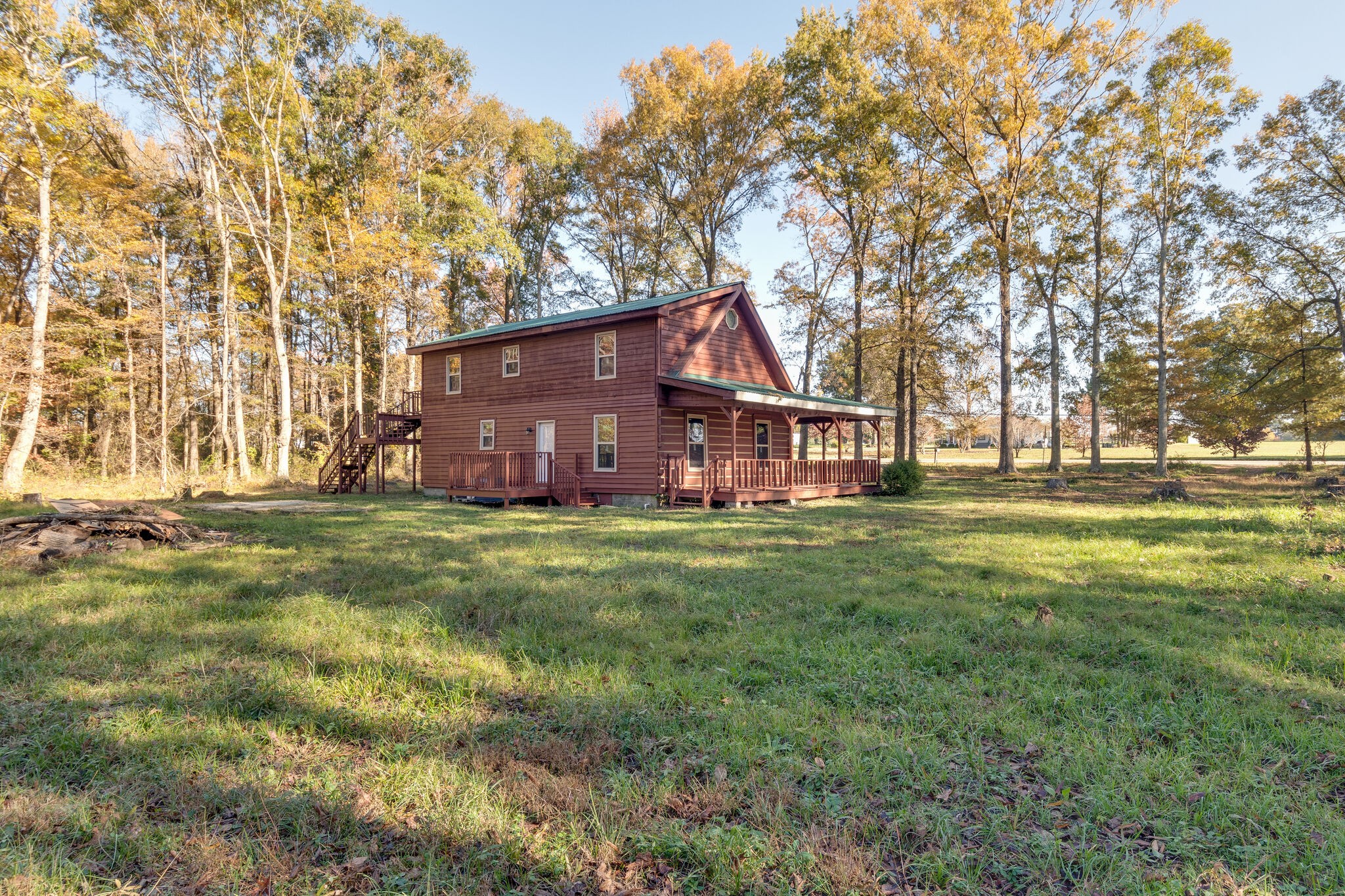 409 Elora Road Elora, TN 37328 - Photo 2 of 25 a view of a house with a big yard and large trees