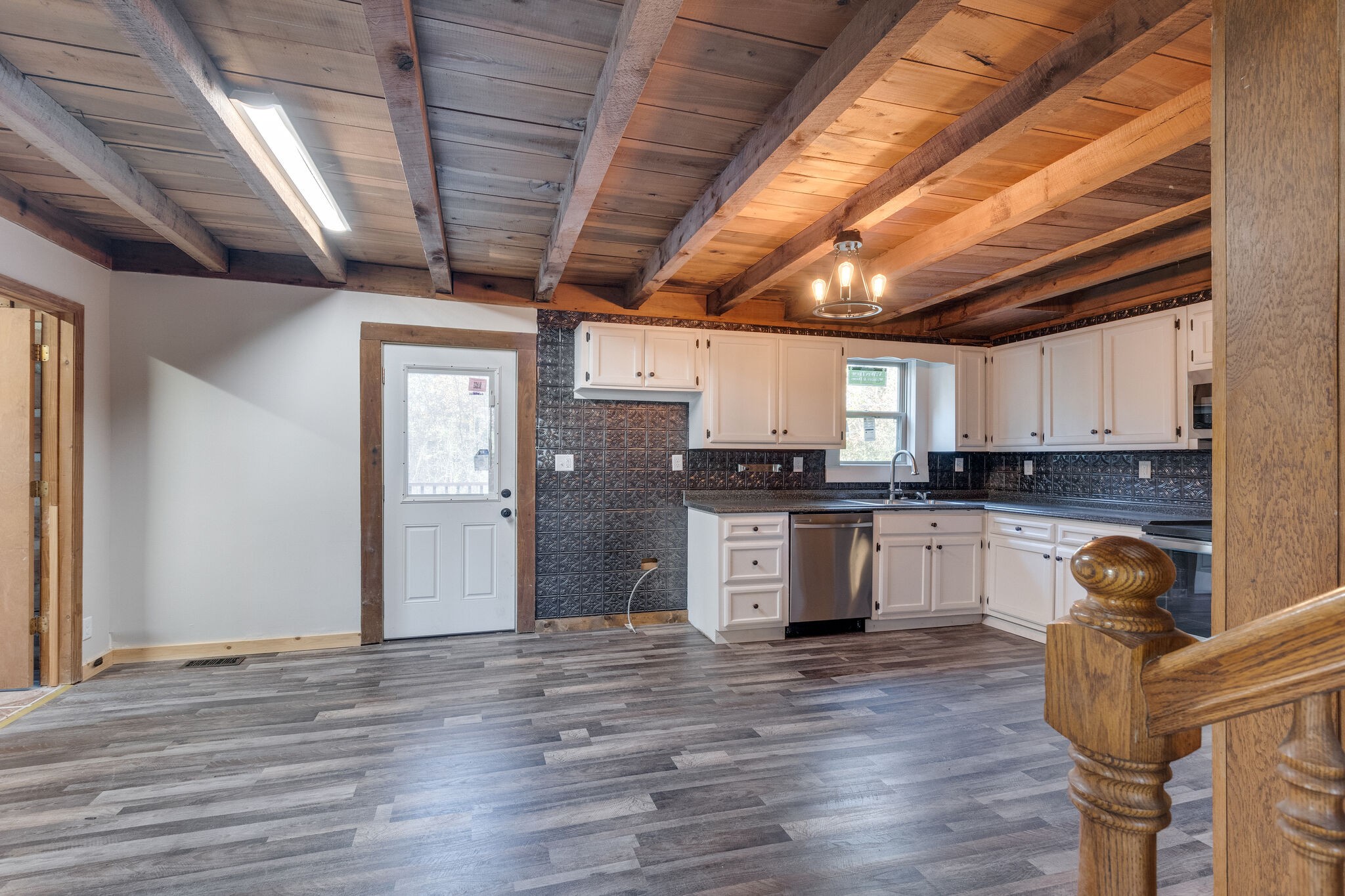 409 Elora Road Elora, TN 37328 - Photo 11 of 25 a kitchen with granite countertop wooden floors and white stainless steel appliances