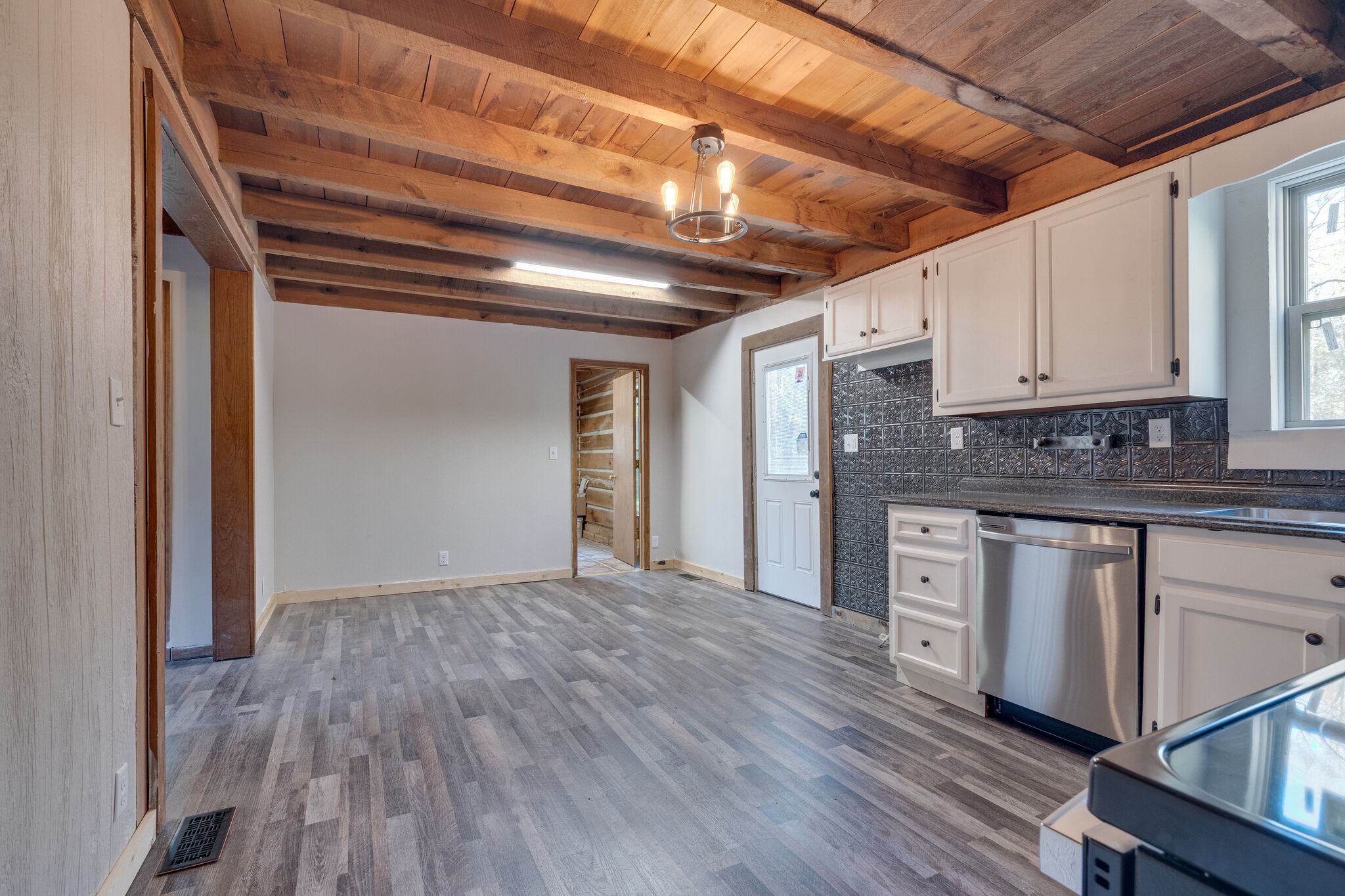 409 Elora Road Elora, TN 37328 - Photo 14 of 25 a view of empty room with wooden floor and cabinets