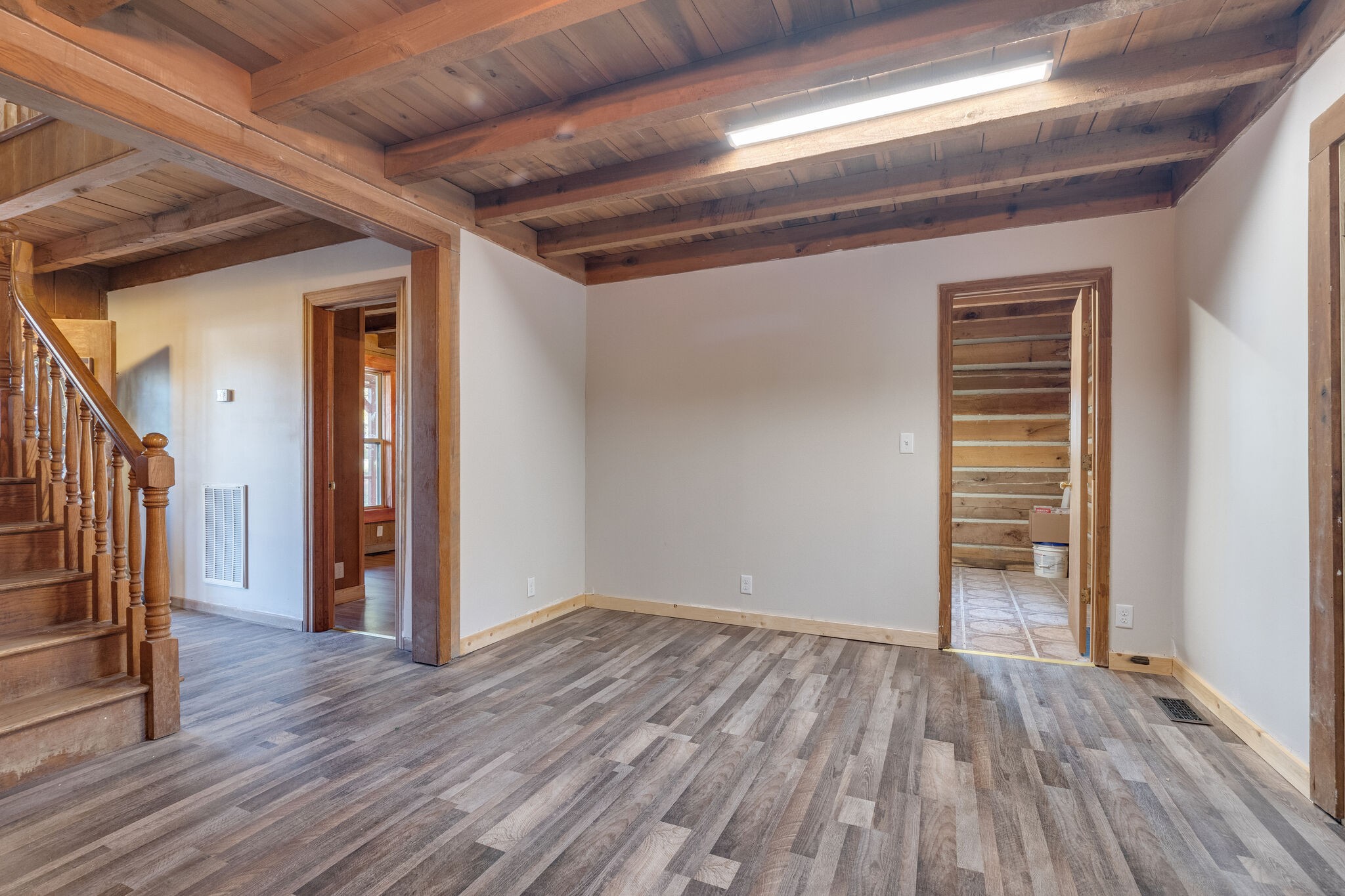 409 Elora Road Elora, TN 37328 - Photo 15 of 25 a view of an empty room with wooden floor and a window