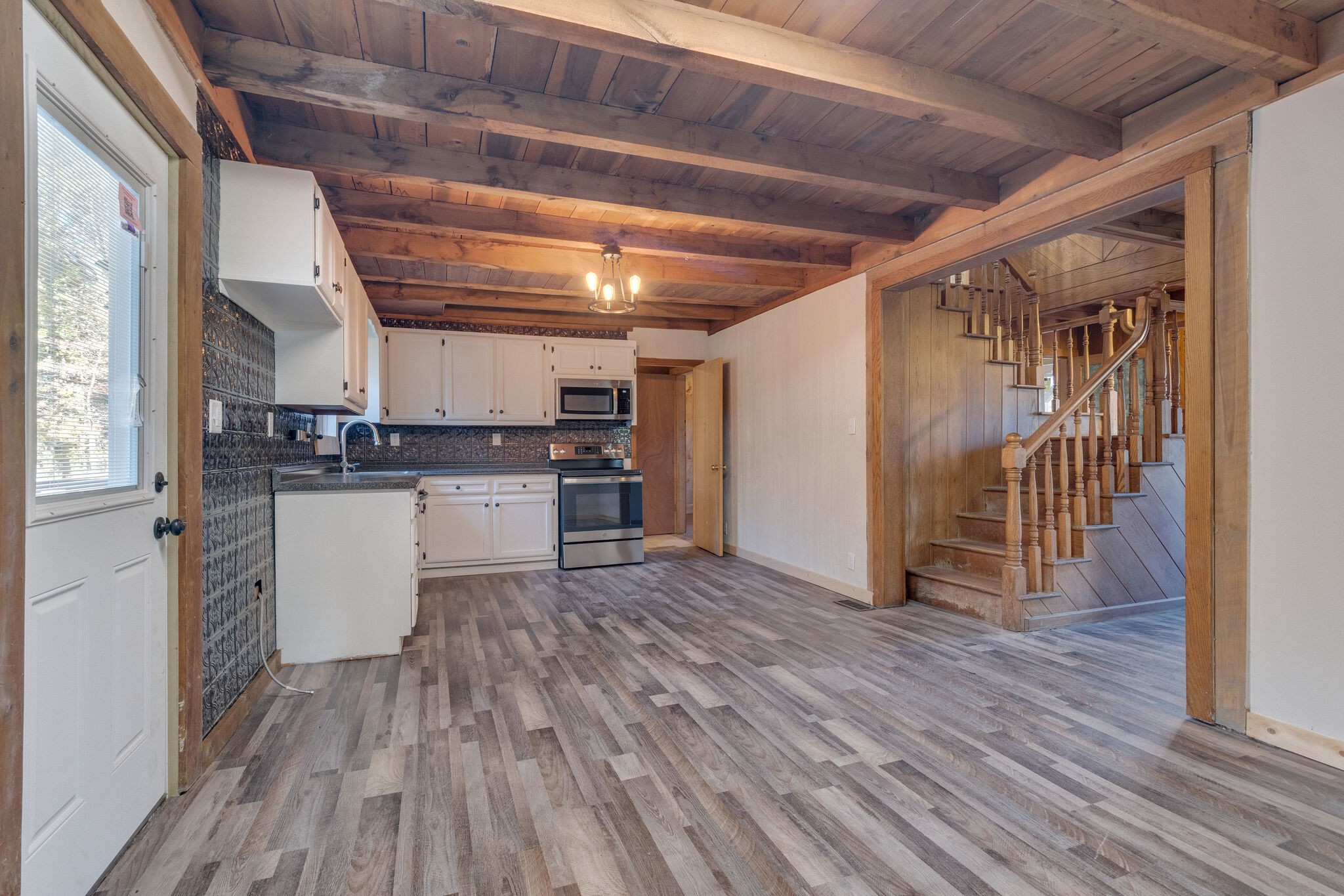 409 Elora Road Elora, TN 37328 - Photo 16 of 25 a view of a kitchen with wooden floor and electronic appliances