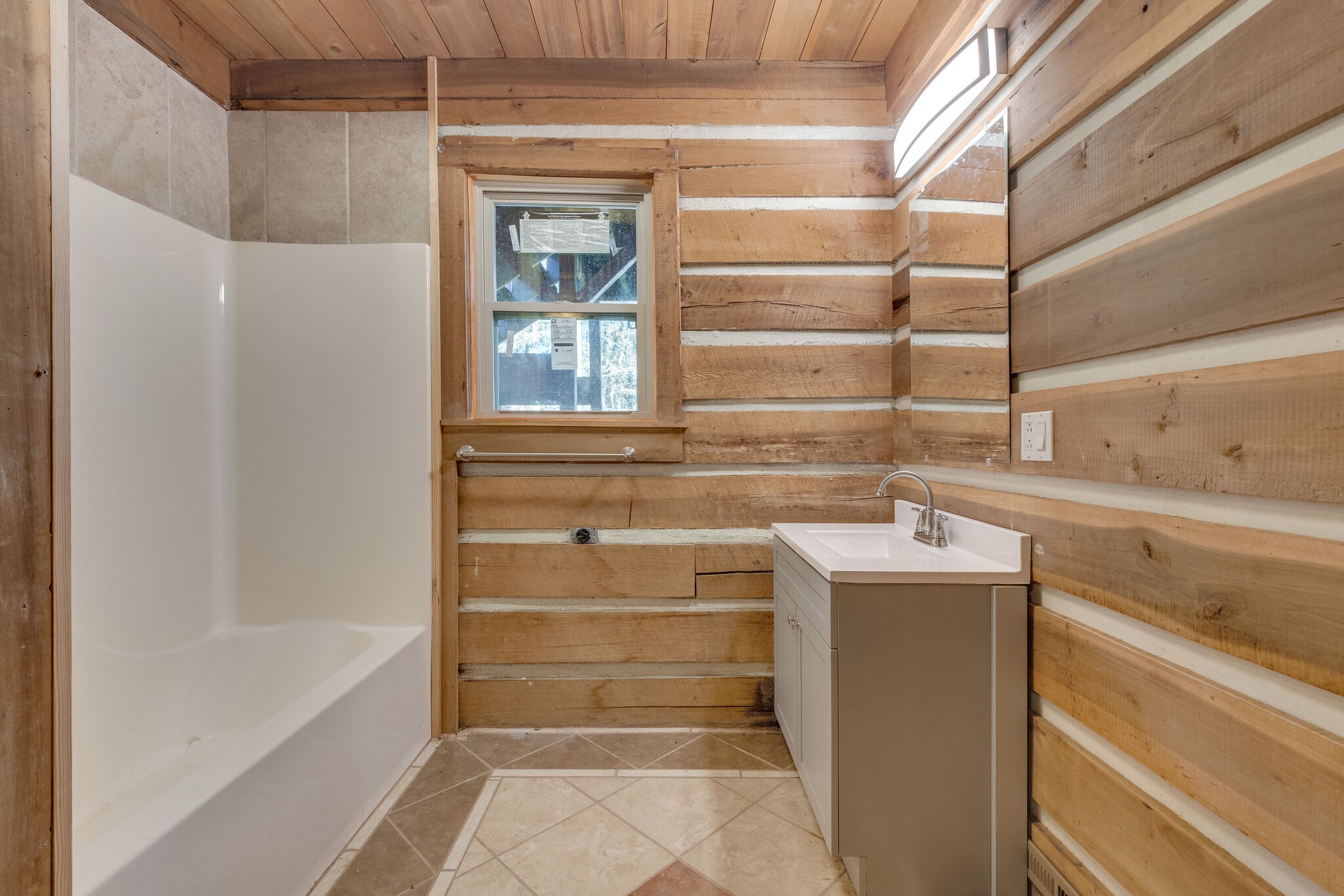 409 Elora Road Elora, TN 37328 - Photo 19 of 25 a bathroom with a tub sink and mirror