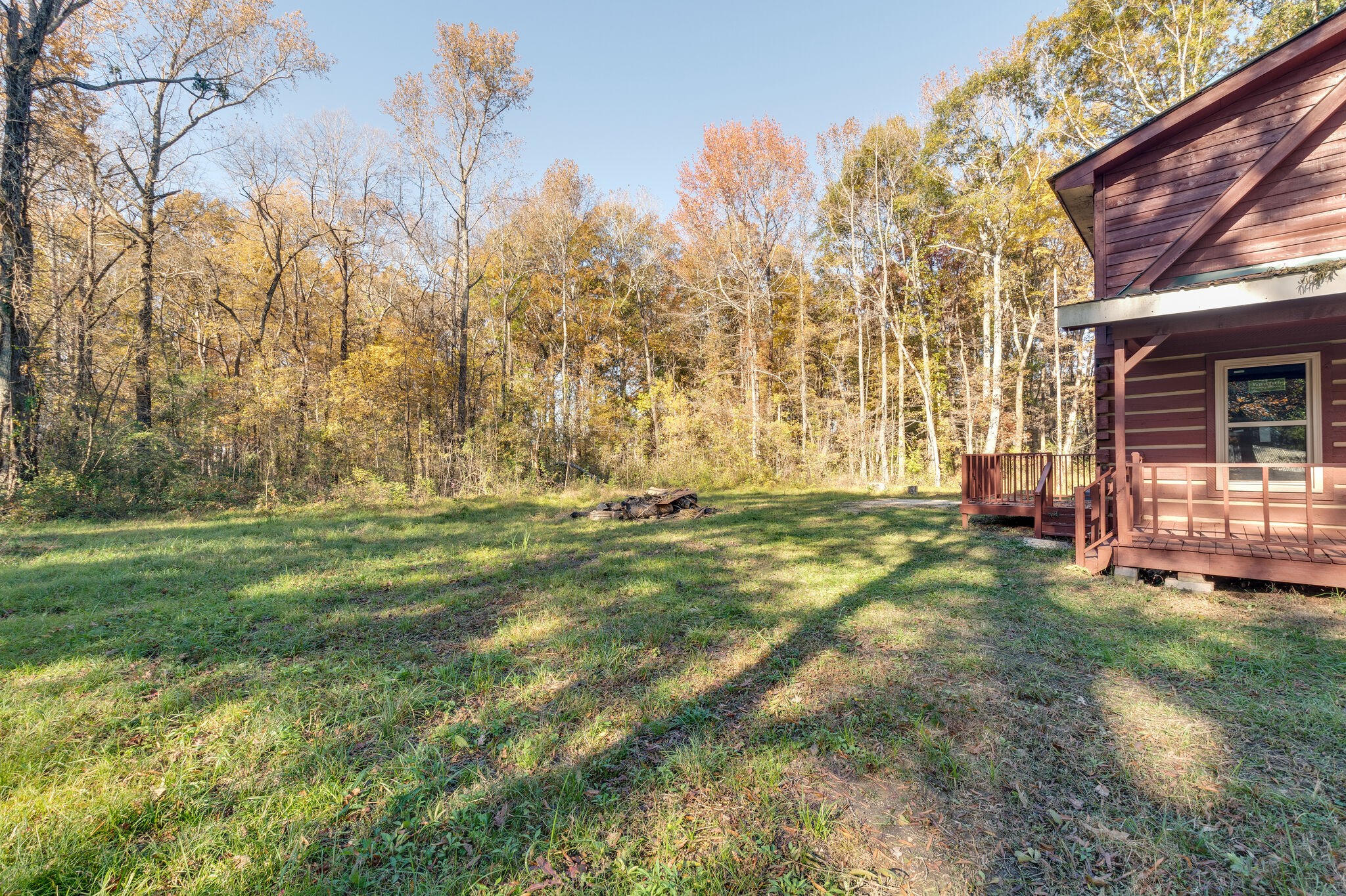 409 Elora Road Elora, TN 37328 - Photo 3 of 25 a backyard of a house with lots of green space