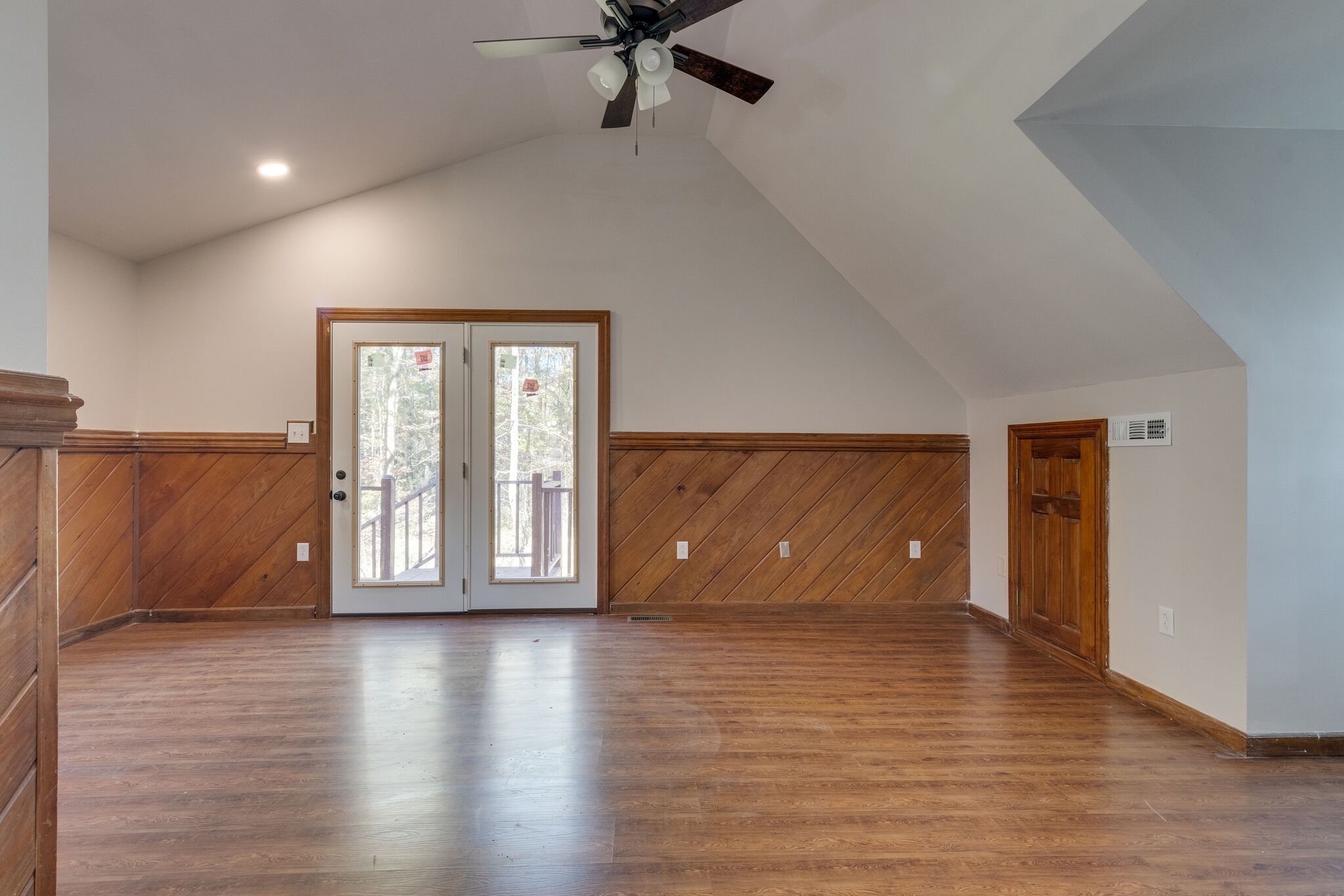 409 Elora Road Elora, TN 37328 - Photo 21 of 25 an empty room with wooden floor and windows