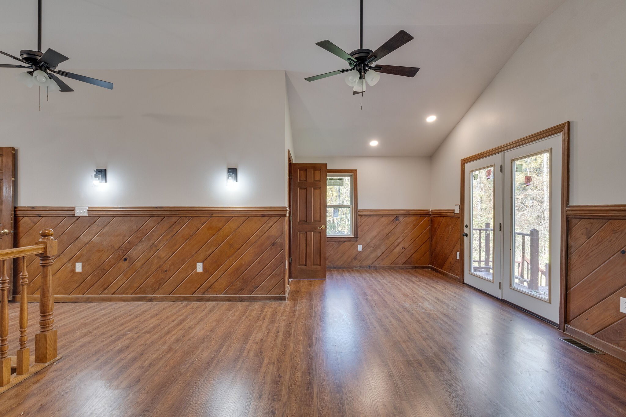 409 Elora Road Elora, TN 37328 - Photo 22 of 25 a view of a livingroom with a hardwood floor and a ceiling fan