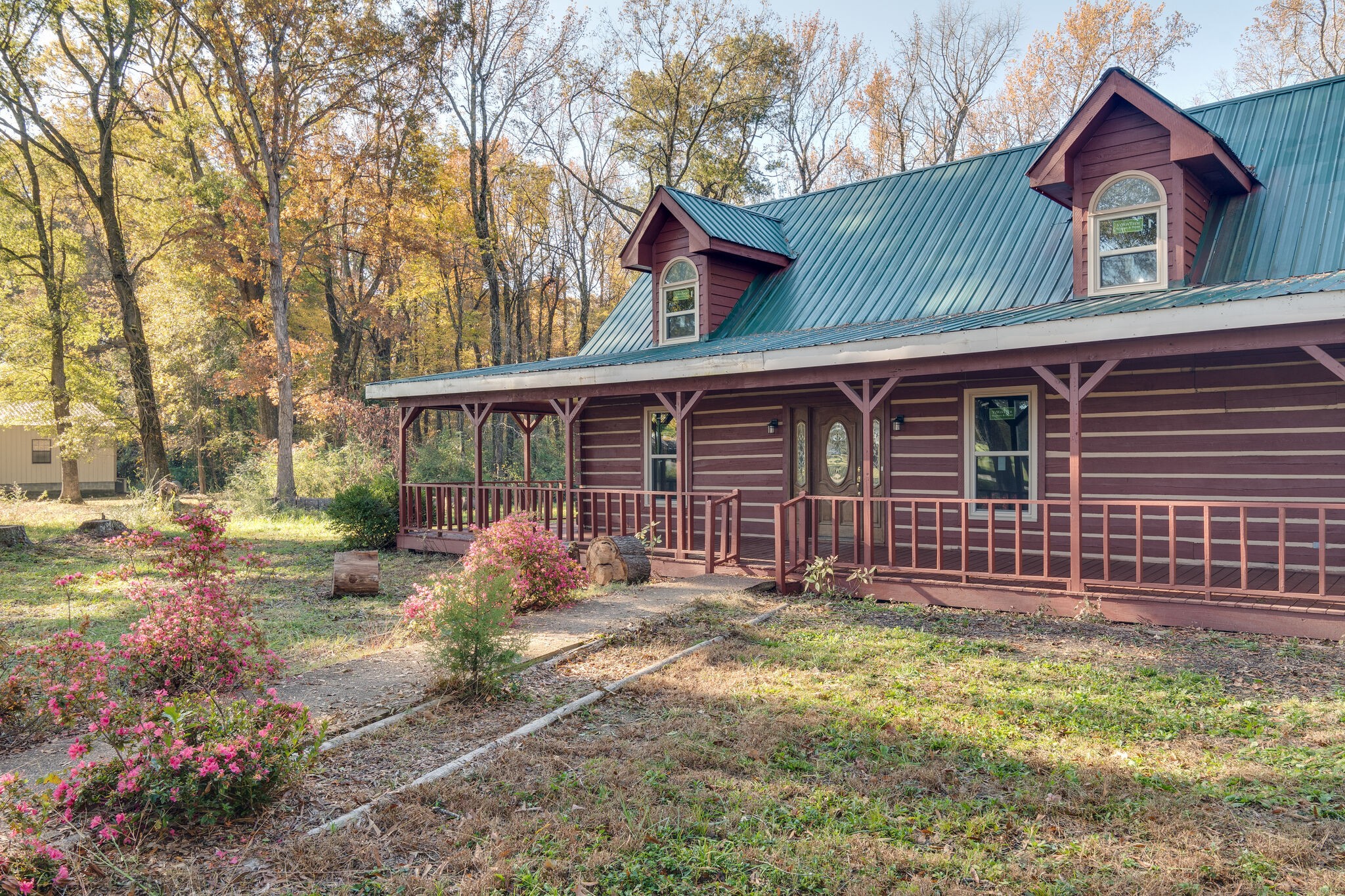 409 Elora Road Elora, TN 37328 - Photo 7 of 25 a front view of a house with garden
