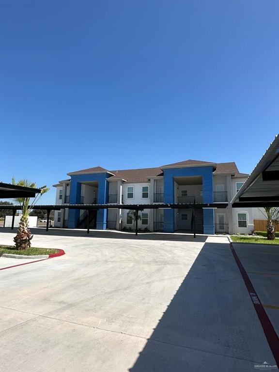 a view of a house with a snow on the road
