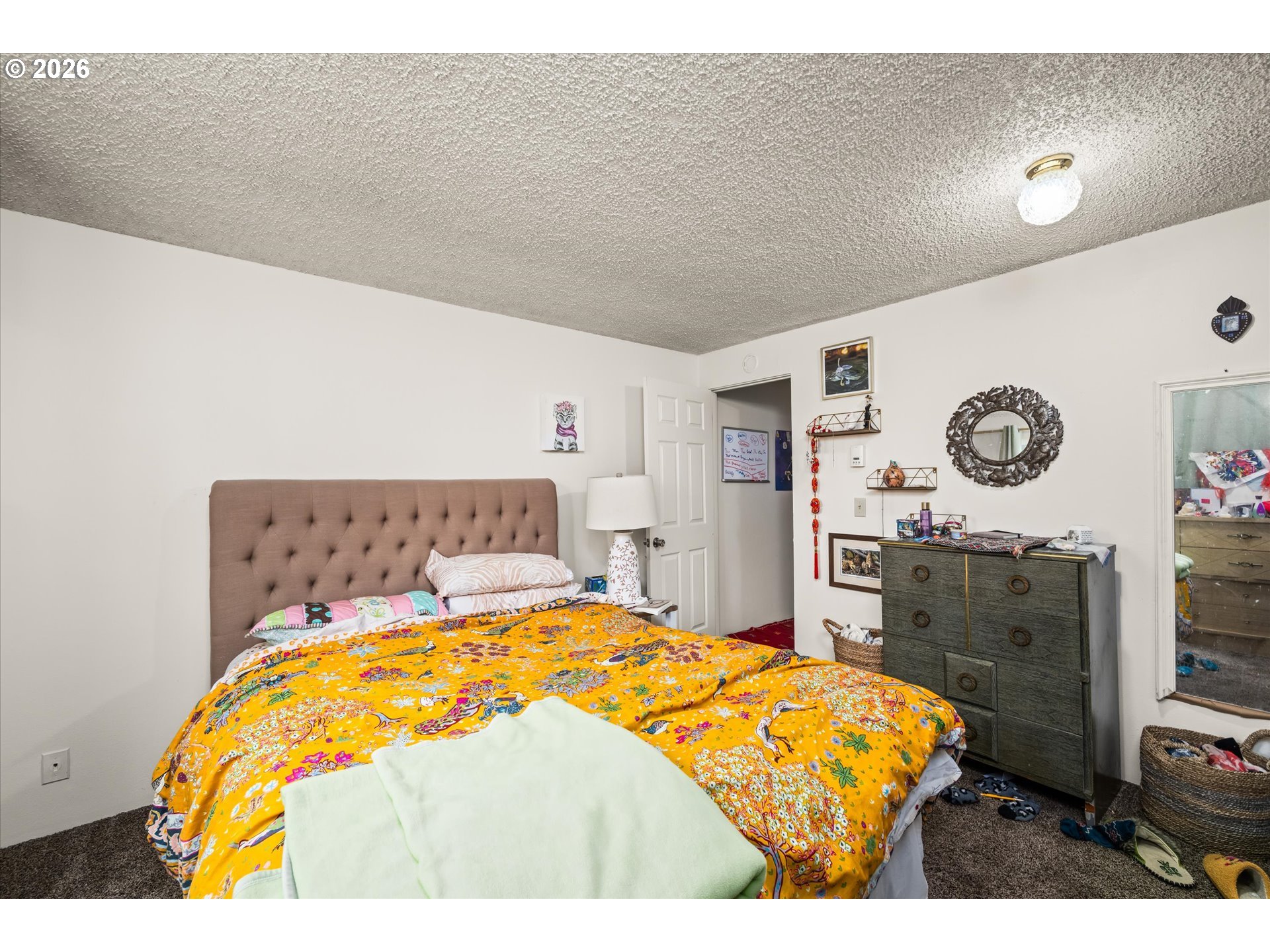 2145 Hawkins Lane Eugene, OR 97405 - Photo 14 of 38 a bedroom with a bed and a lamp on dresser