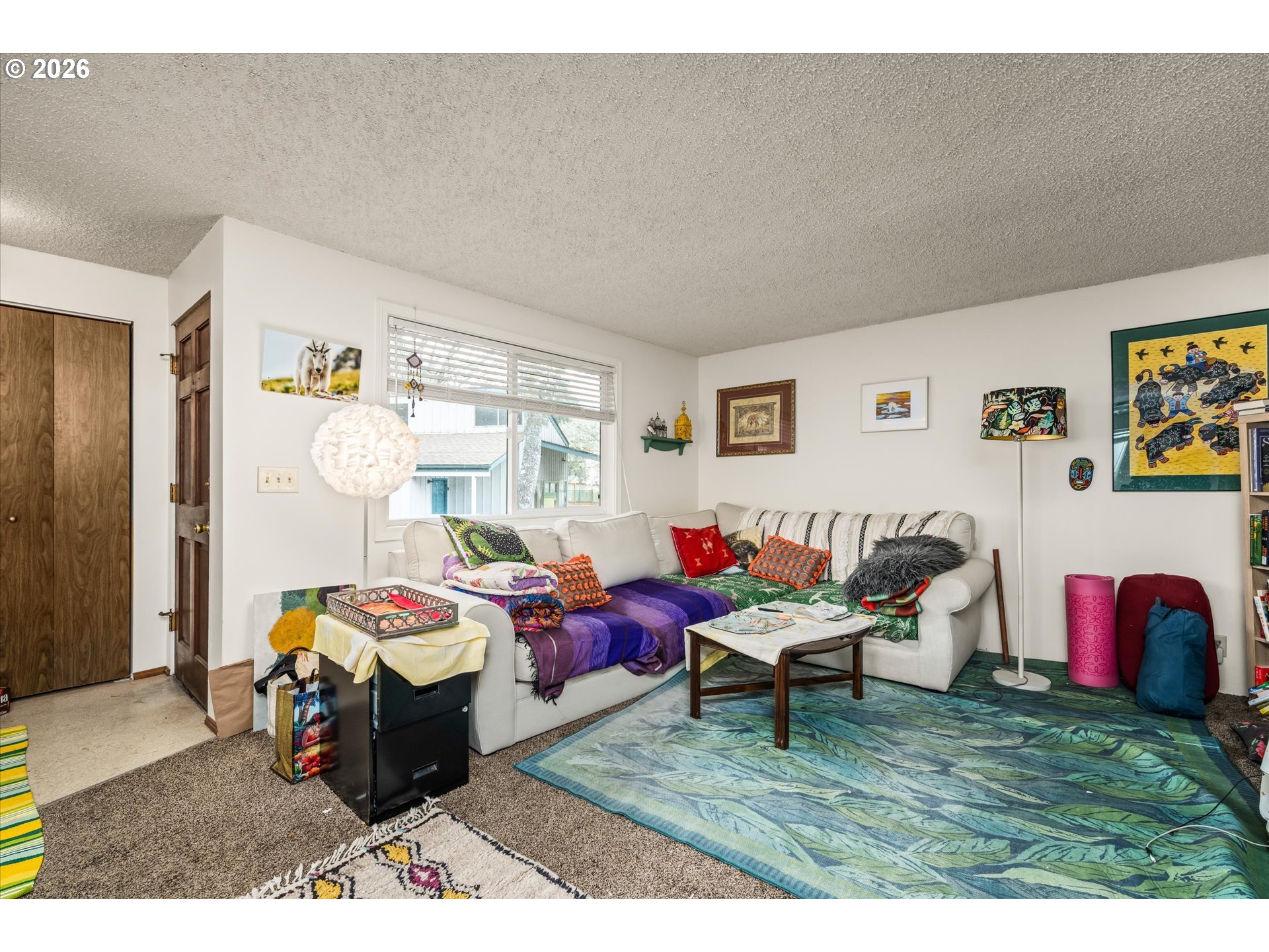 2145 Hawkins Lane Eugene, OR 97405 - Photo 7 of 38 a bed room with a bed and a chair