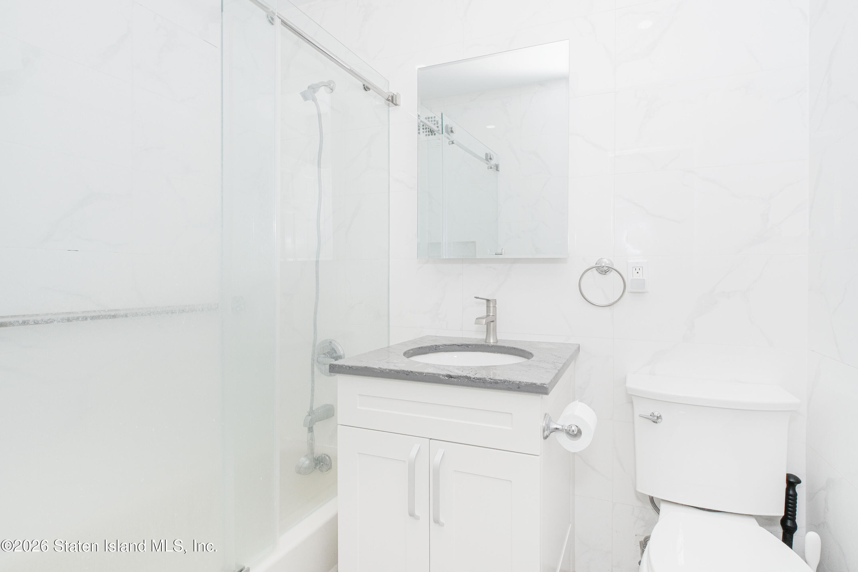 1160 Richmond Road, Unit 4G Staten Island, NY 10304 - Photo 11 of 14 a bathroom with a sink and a mirror