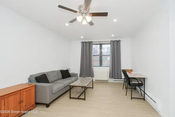 a living room with furniture and a window