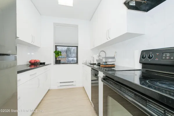 a kitchen with sink and stove