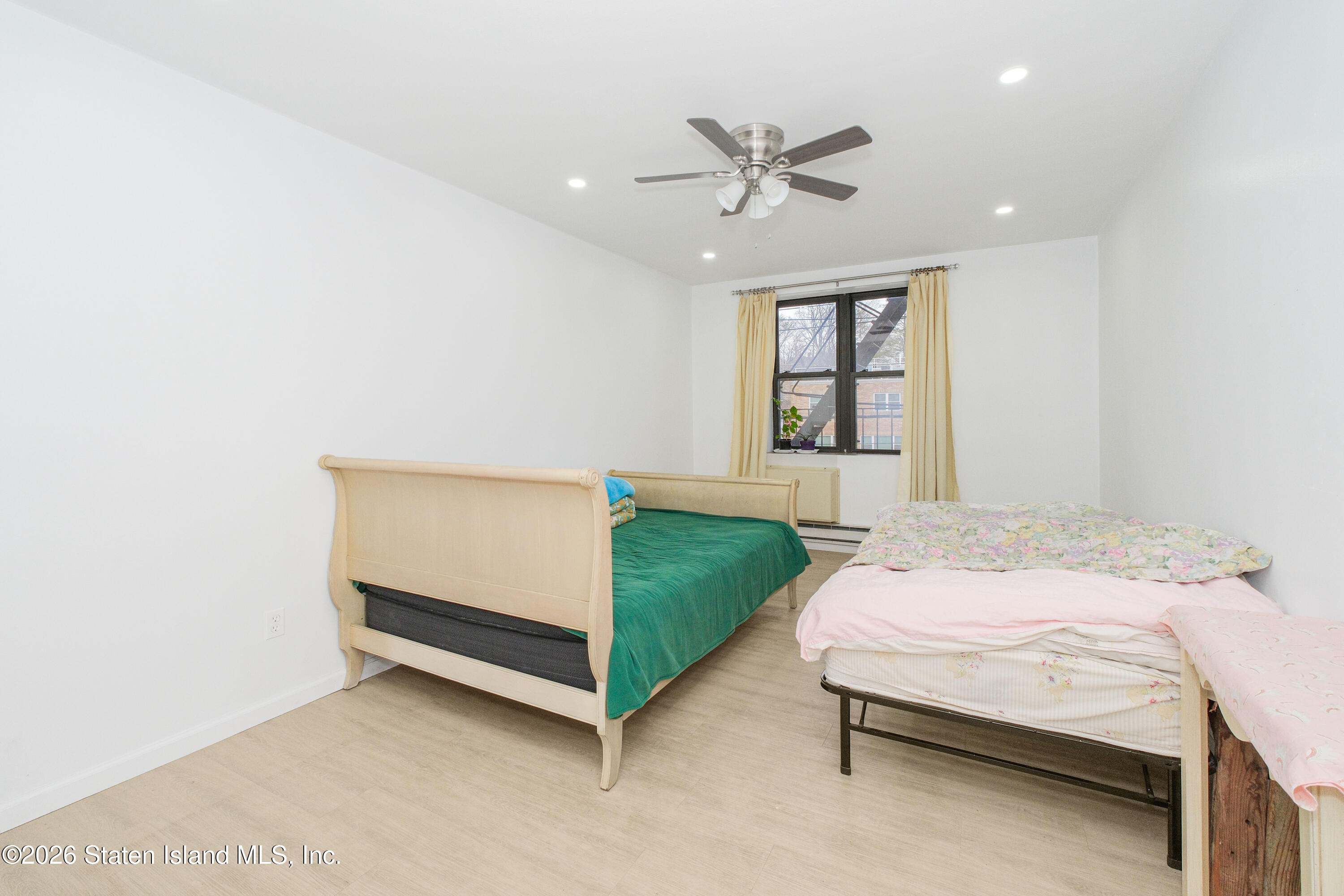 1160 Richmond Road, Unit 4G Staten Island, NY 10304 - Photo 10 of 14 a bedroom with a bed and window
