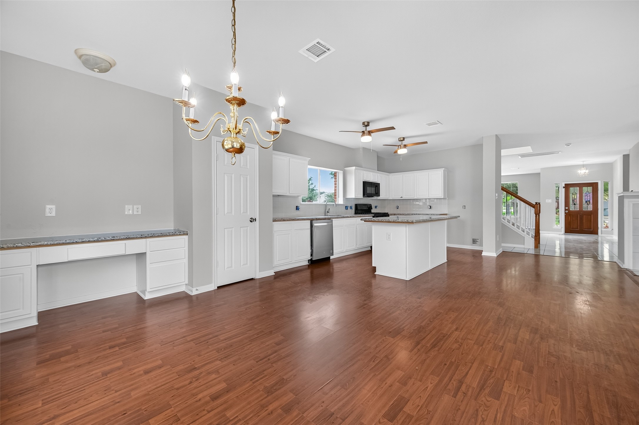 1302 Cross Draw Drive Houston, TX 77067 - Photo 11 of 35 a view of a kitchen with a sink dishwasher a kitchen view and wooden floor