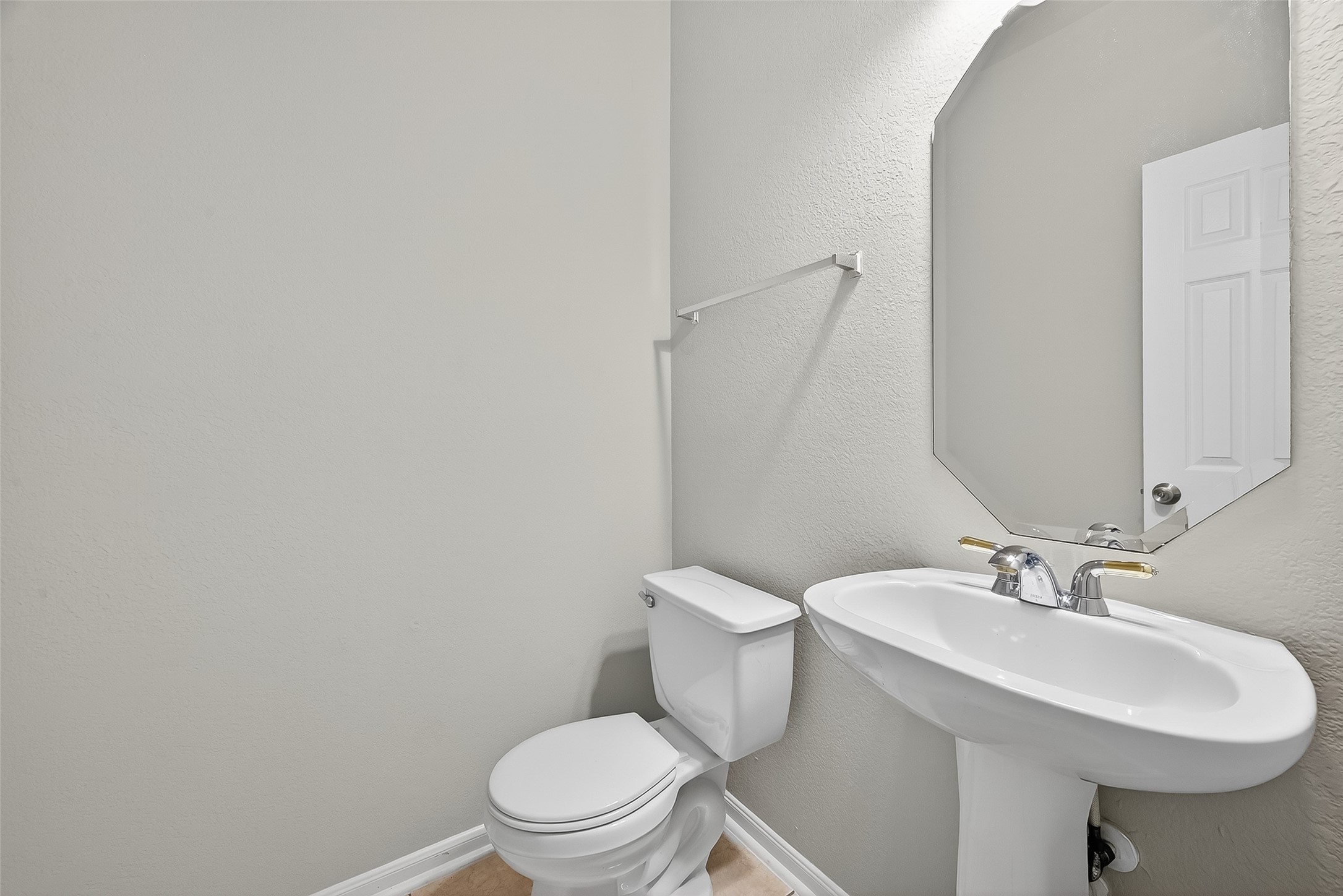 1302 Cross Draw Drive Houston, TX 77067 - Photo 15 of 35 a white toilet sitting next to a bathroom sink