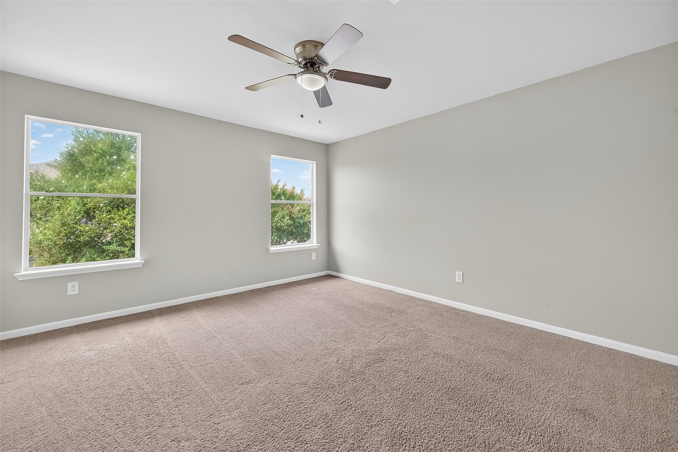 1302 Cross Draw Drive Houston, TX 77067 - Photo 22 of 35 an empty room with a window and a fan