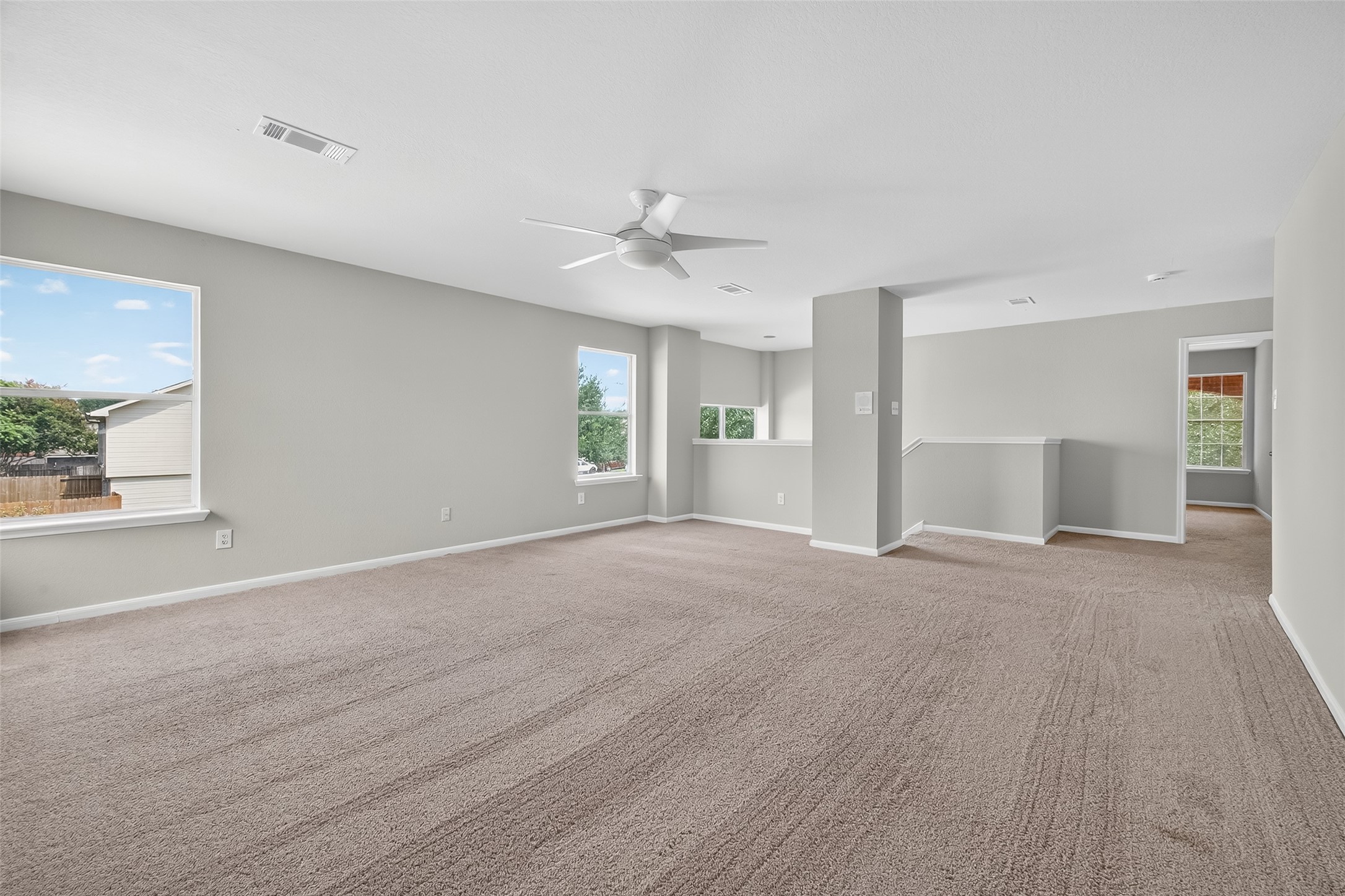 1302 Cross Draw Drive Houston, TX 77067 - Photo 25 of 35 a view of a livingroom with a ceiling fan and window