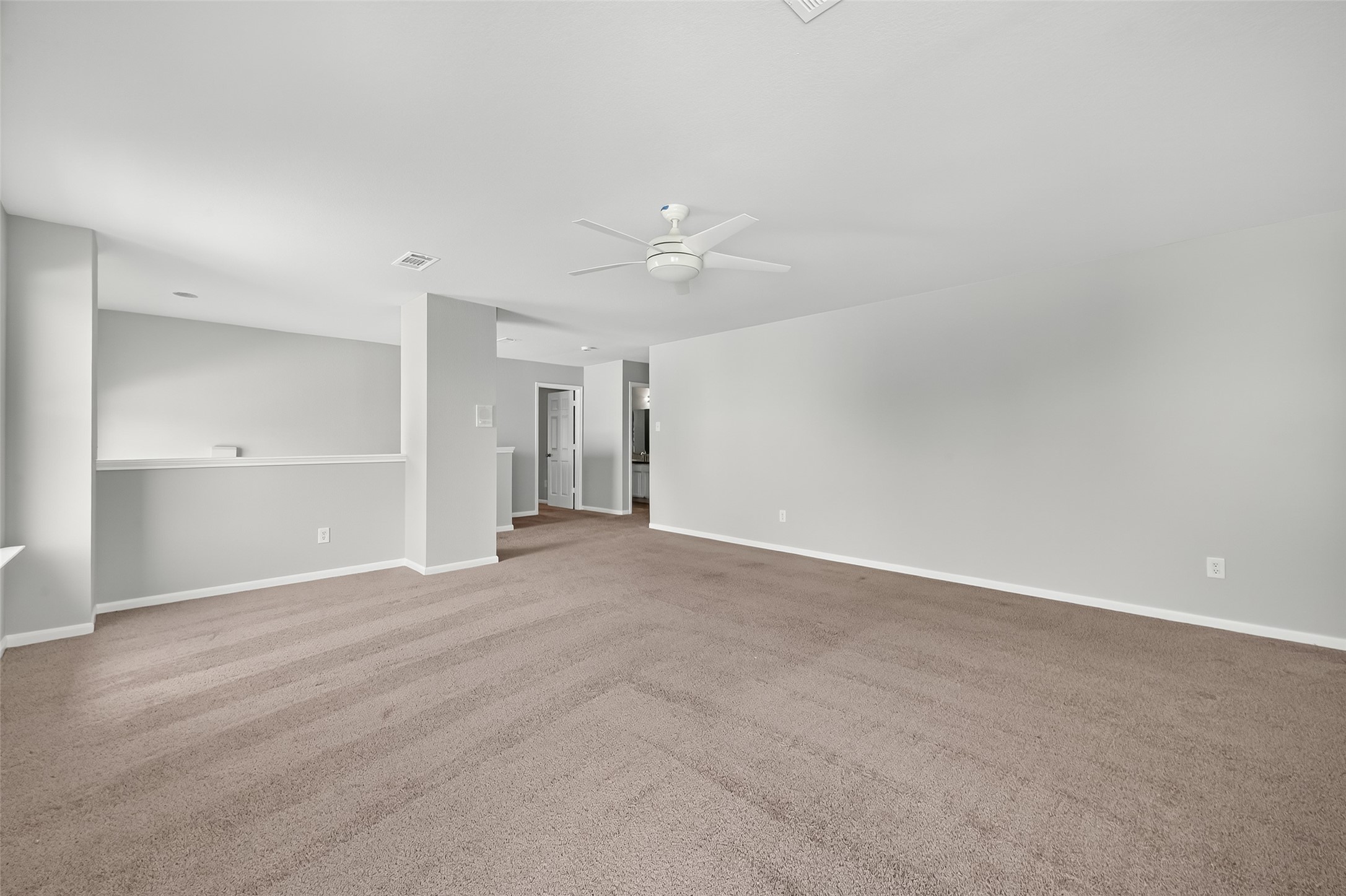 1302 Cross Draw Drive Houston, TX 77067 - Photo 26 of 35 a view of an empty room with a kitchen