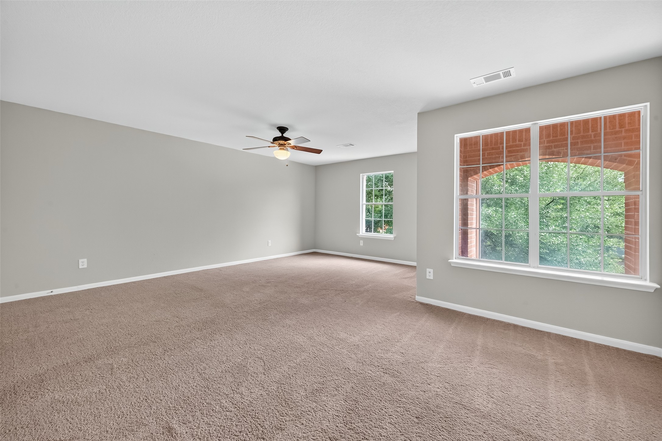 1302 Cross Draw Drive Houston, TX 77067 - Photo 28 of 35 a view of a livingroom with an empty space and a window