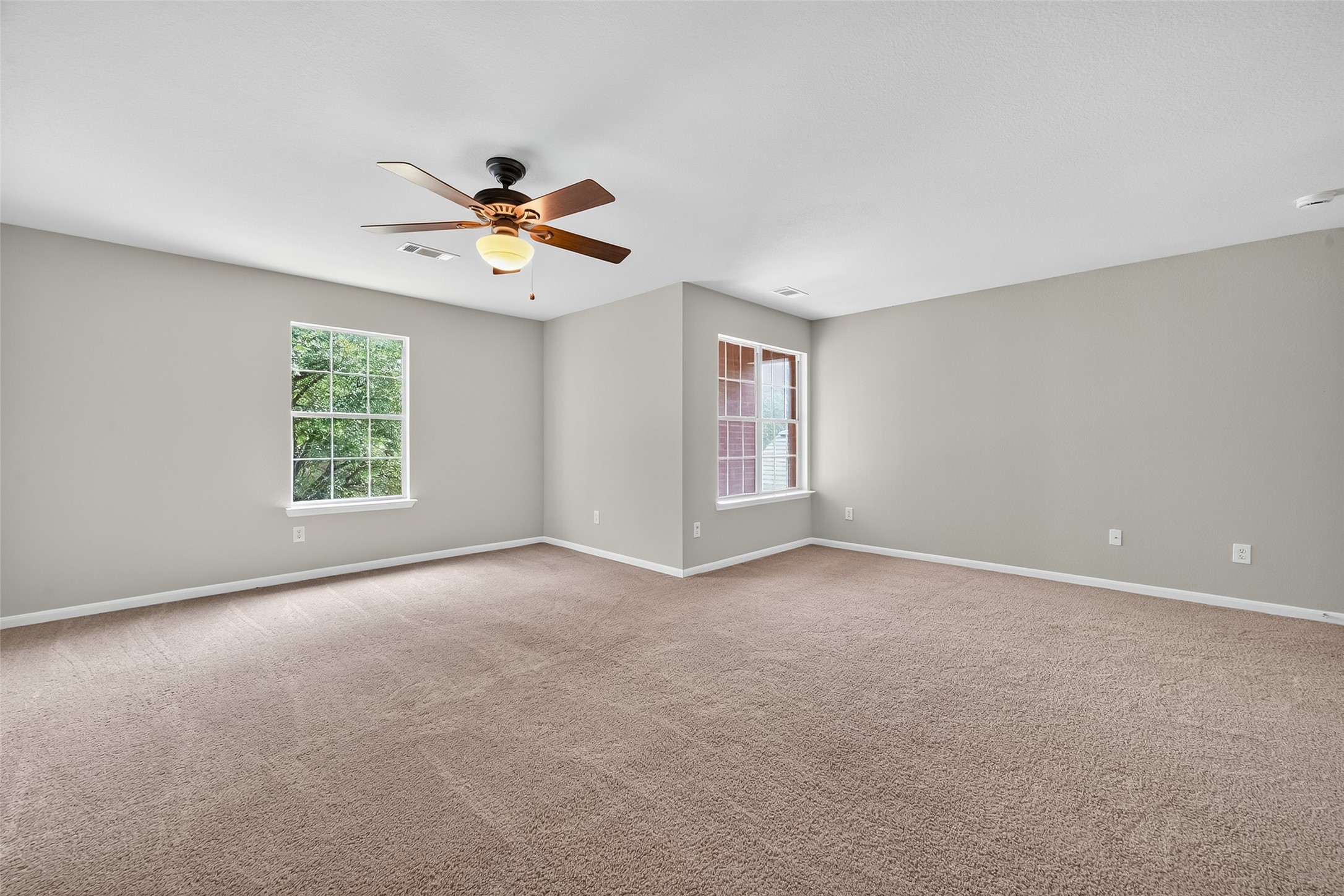 1302 Cross Draw Drive Houston, TX 77067 - Photo 29 of 35 a view of a room with windows and ceiling fan