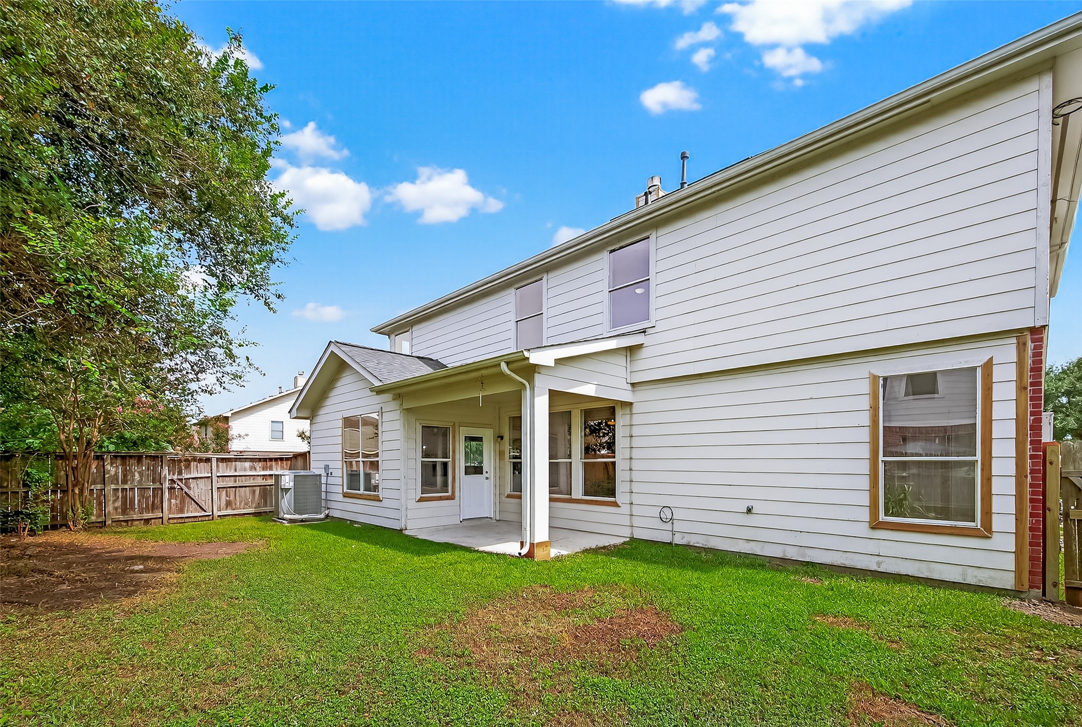 1302 Cross Draw Drive Houston, TX 77067 - Photo 34 of 35 a view of a white house with a yard