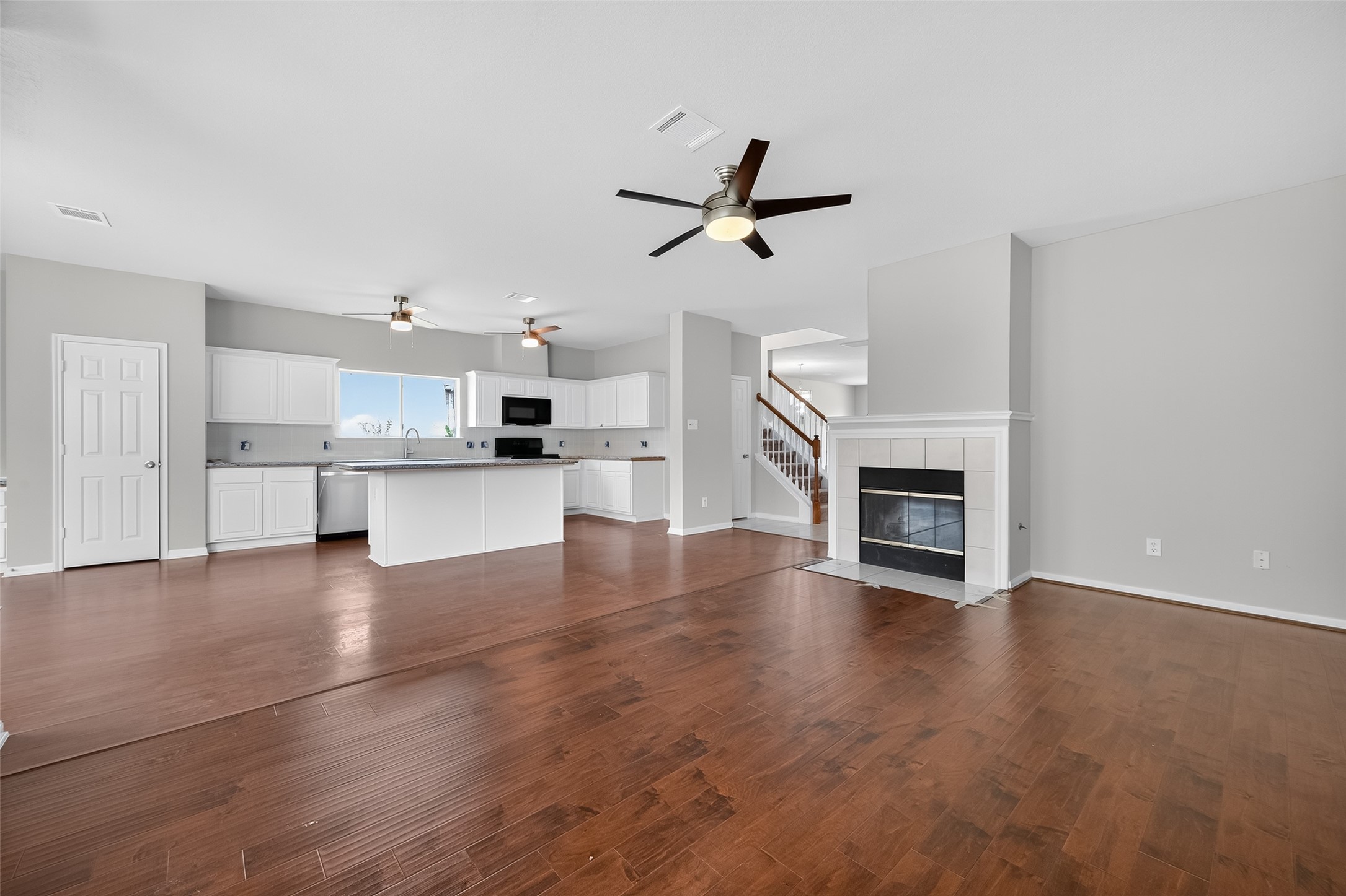 1302 Cross Draw Drive Houston, TX 77067 - Photo 7 of 35 a view of a kitchen with wooden floor and a sink