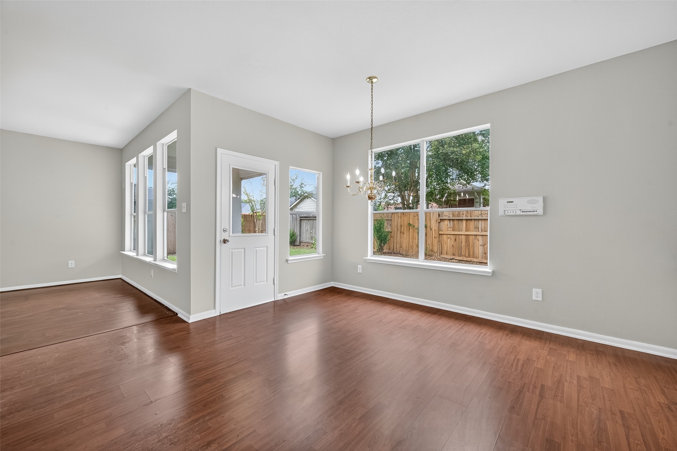 1302 Cross Draw Drive Houston, TX 77067 - Photo 9 of 35 an empty room with wooden floor and windows