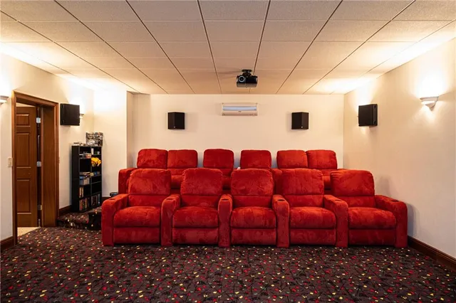 a blue couch sitting in a room next to a window