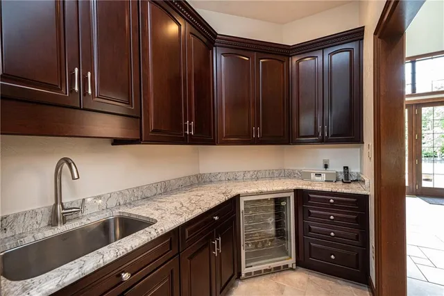 a kitchen with a sink and cabinets