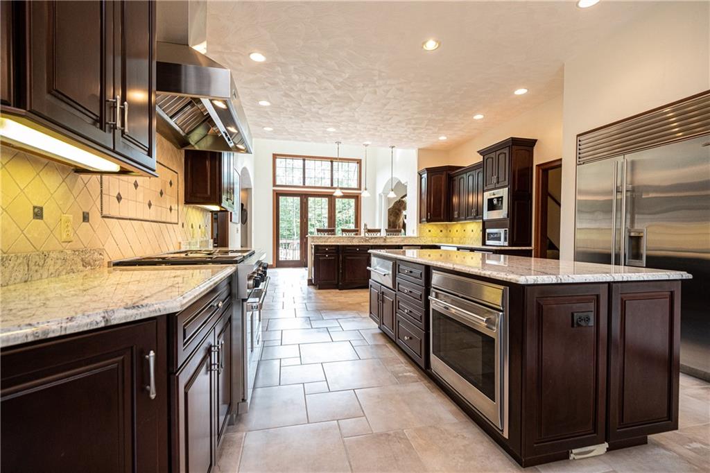 1801 Freeport Road Kittanning, PA 16201 - Photo 27 of 36 a kitchen with stainless steel appliances granite countertop a sink and a stove