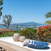 a view of a chairs and table in a patio