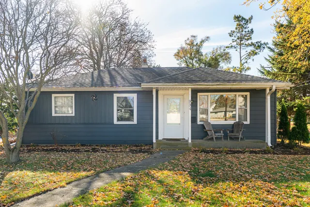 a front view of a house with garden