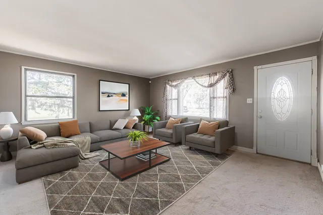 a living room with furniture and windows