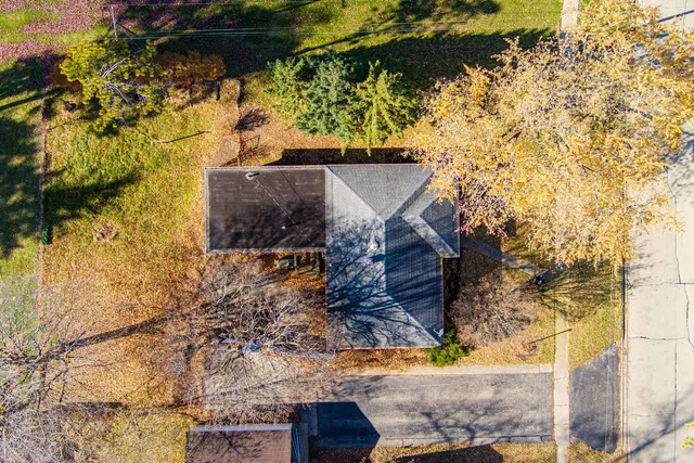 a view of a wooden door and a yard