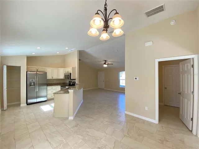 a view of a kitchen and a chandelier
