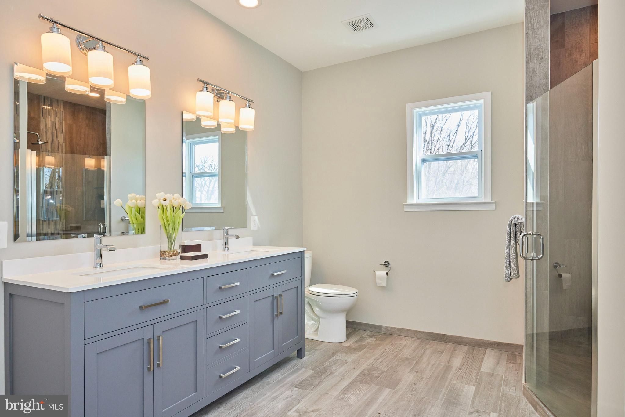 15531 Radwick Lane Silver Spring, MD 20906 - Photo 31 of 56 The primary bathroom, at the back of the house