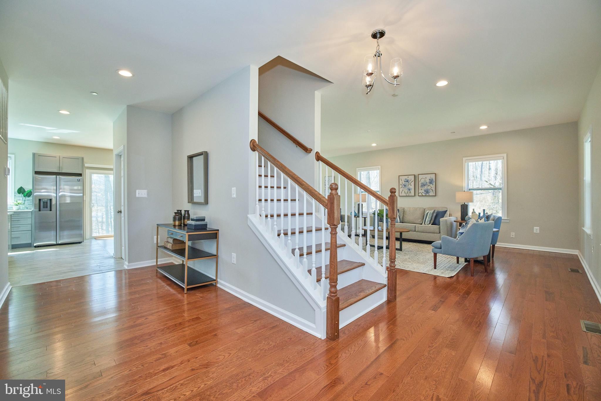 Genrous foyer & gorgeous wide-plank hardwoods