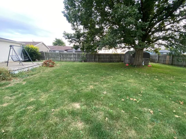 a view of backyard with green space