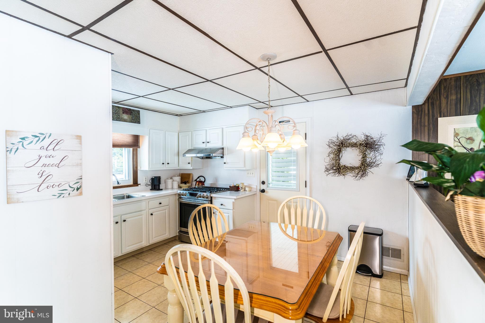3 Fennimore Road Hamilton, NJ 08690 - Photo 12 of 52 a kitchen with stainless steel appliances granite countertop sink stove top oven and cabinets