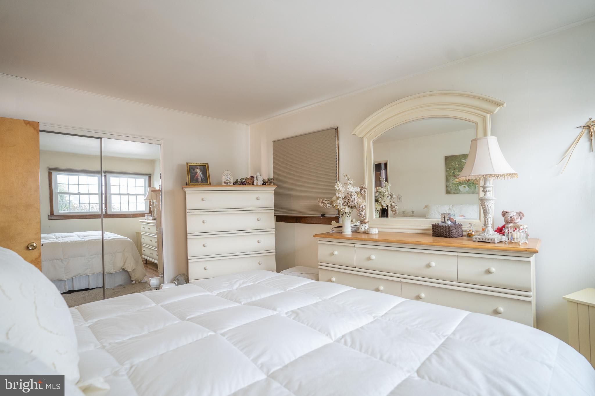 3 Fennimore Road Hamilton, NJ 08690 - Photo 19 of 52 a bedroom with a bed and large mirror