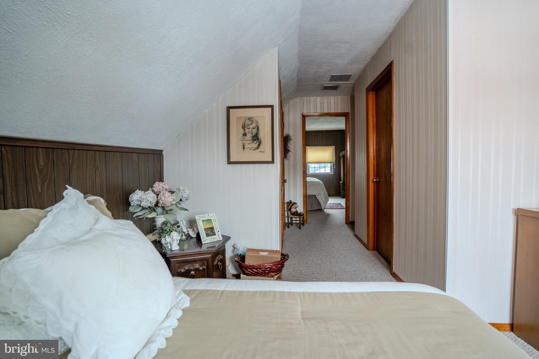 3 Fennimore Road Hamilton, NJ 08690 - Photo 45 of 52 a bedroom with furniture and a chandelier