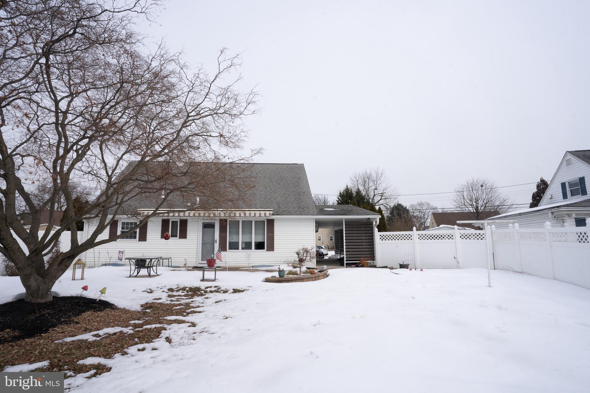 3 Fennimore Road Hamilton, NJ 08690 - Photo 48 of 52 a view of a white house with a large tree in front of it