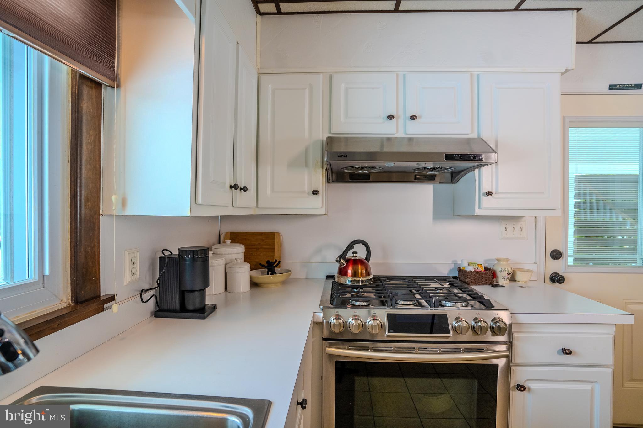 3 Fennimore Road Hamilton, NJ 08690 - Photo 8 of 52 a kitchen with a stove and a refrigerator
