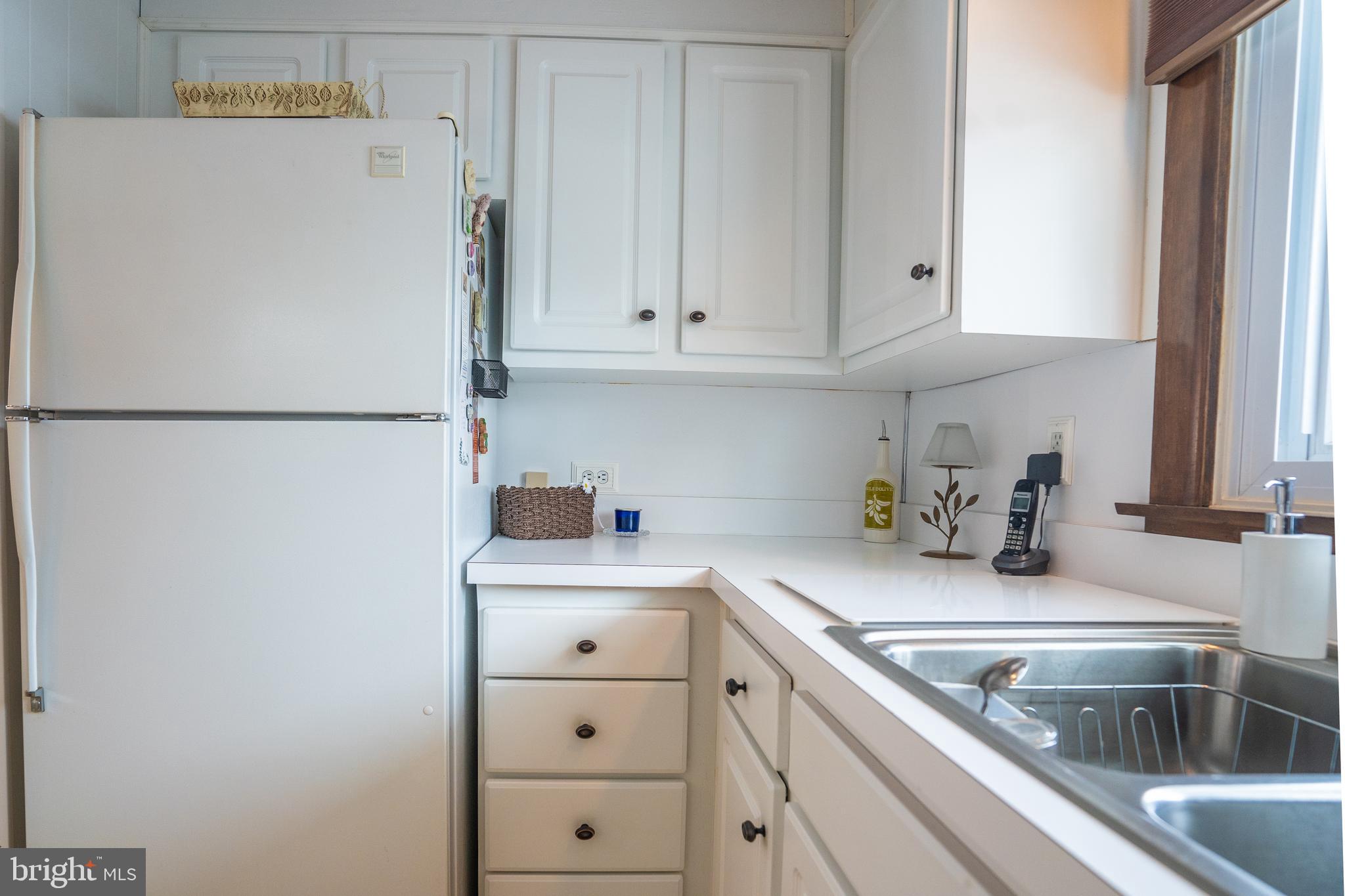 3 Fennimore Road Hamilton, NJ 08690 - Photo 9 of 52 a white refrigerator freezer sitting inside of a kitchen