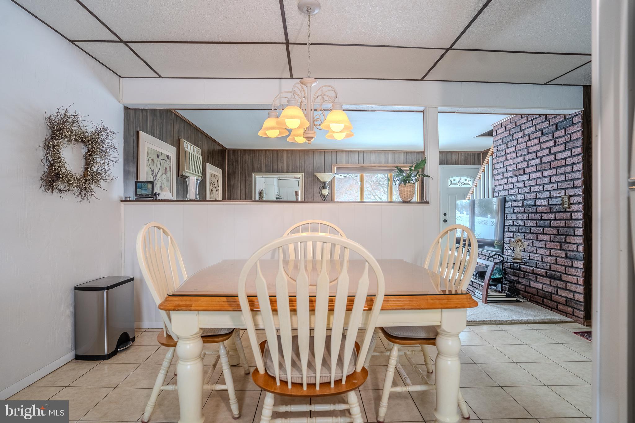 3 Fennimore Road Hamilton, NJ 08690 - Photo 10 of 52 a view of a dining room with furniture and a chandelier
