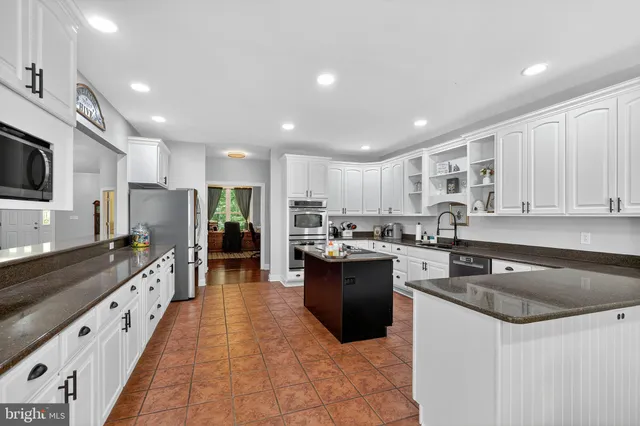 a view of a livingroom with furniture and a window