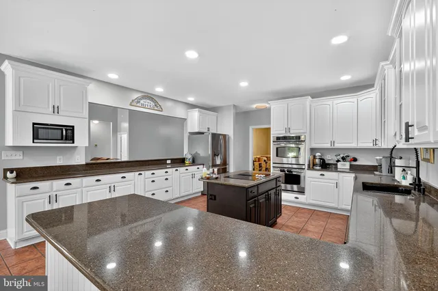a bedroom with a bed and a ceiling fan
